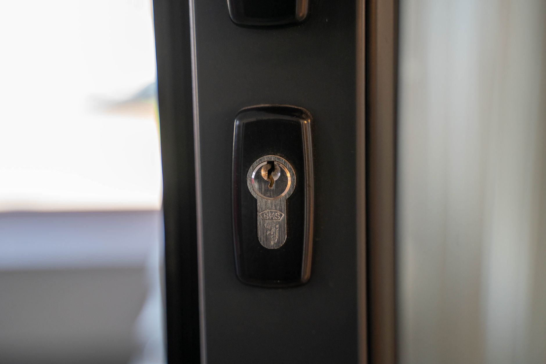 Close-up of a uPVC door lock and handle