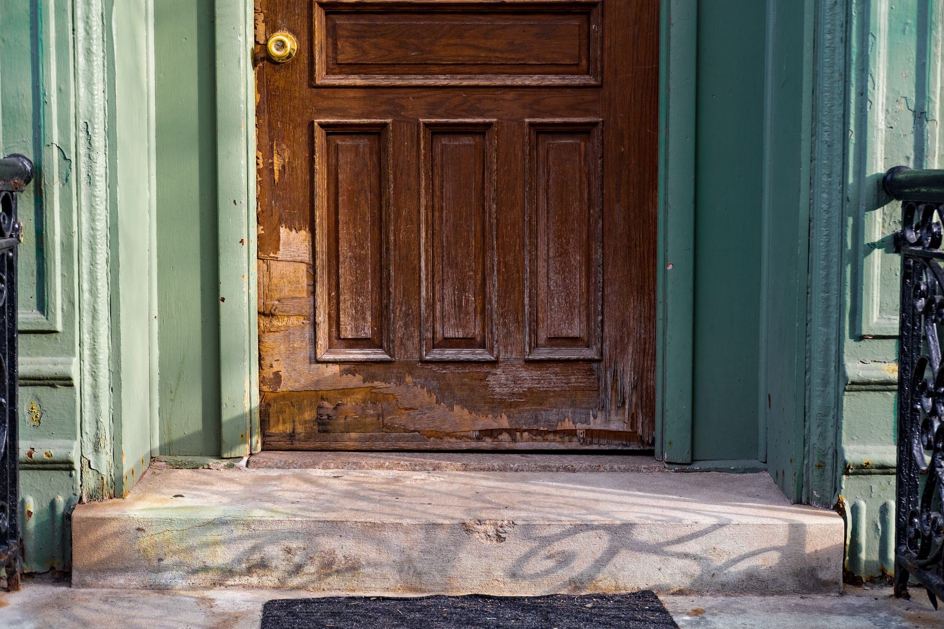 Front door damaged after a forced entry
